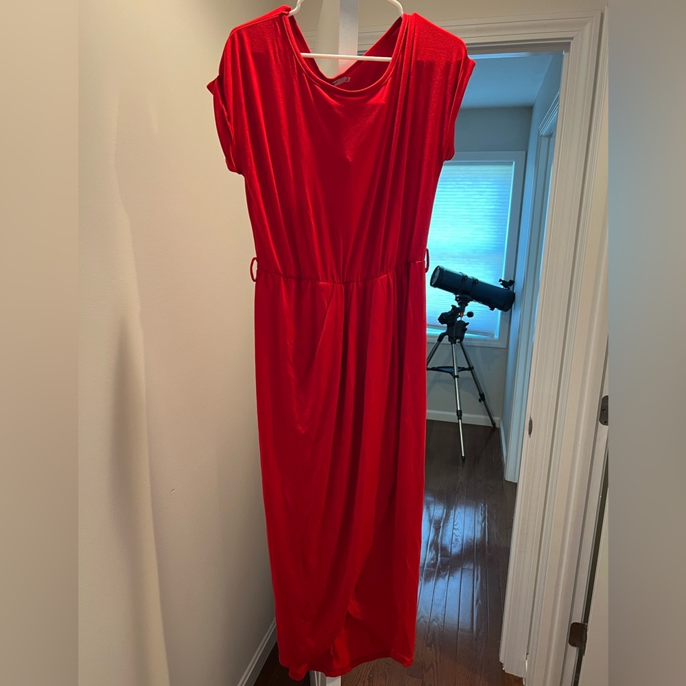 New dress. Front has a slit as design. Belt and tags still on. Size large.